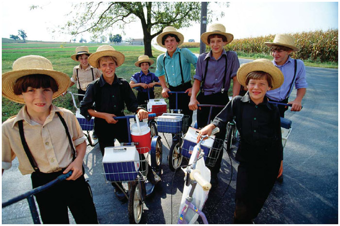 Amish children use scooters to get to school in Lancaster County, Pennsylvania.